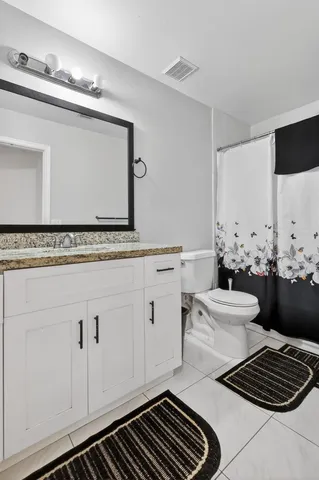 a room with gym equipment and a large window