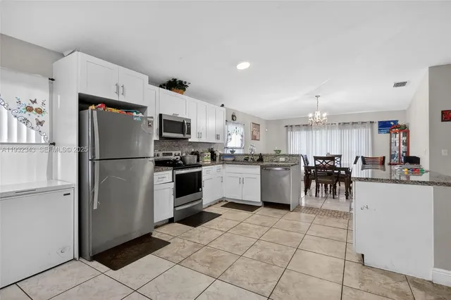 a kitchen with furniture and cabinets