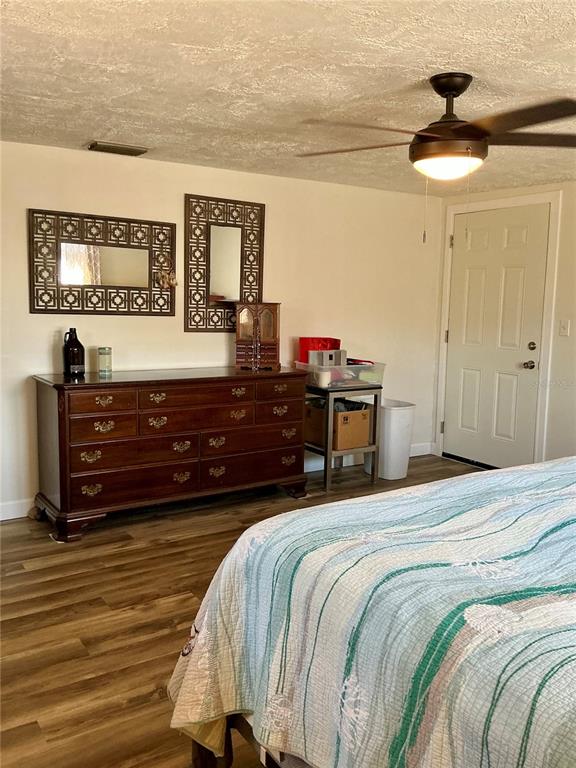 3020 Hawthorne Street Sarasota, FL 34239 - Photo 11 of 22 a bedroom with a bed and a chandelier