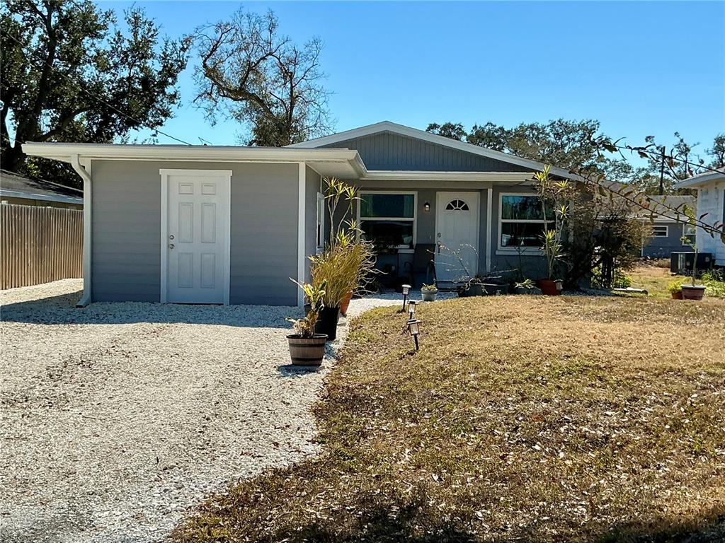 3020 Hawthorne Street Sarasota, FL 34239 - Photo 19 of 22 a front view of a house with a yard covered with snow in front of house