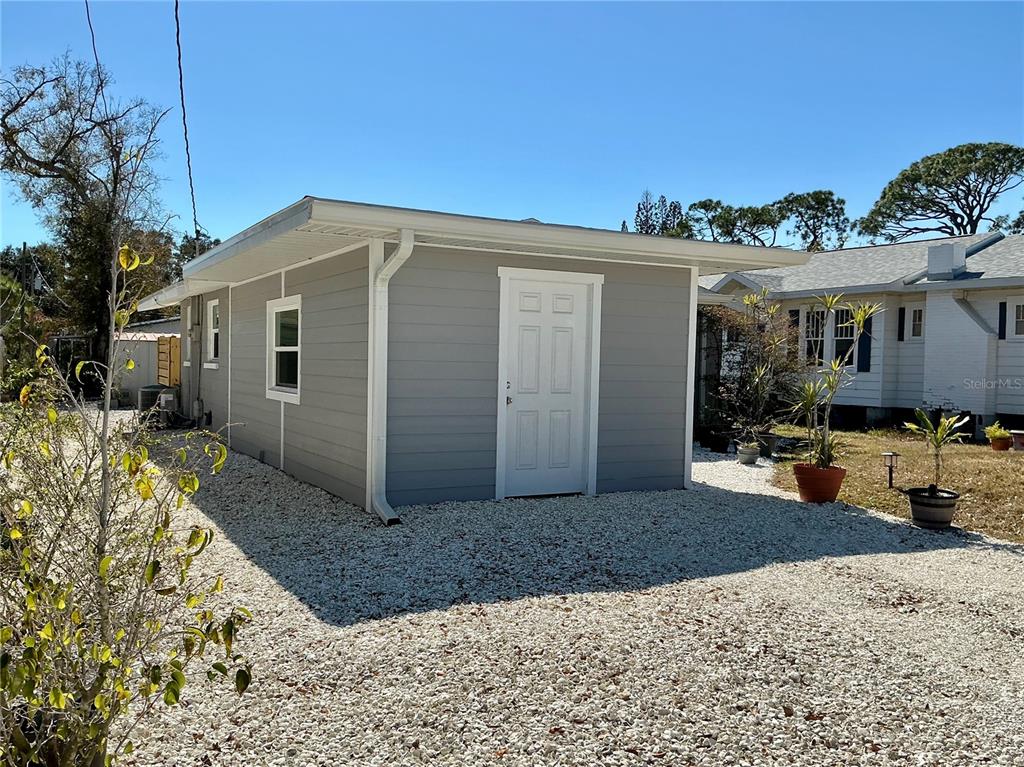 3020 Hawthorne Street Sarasota, FL 34239 - Photo 20 of 22 a view of a house with a yard