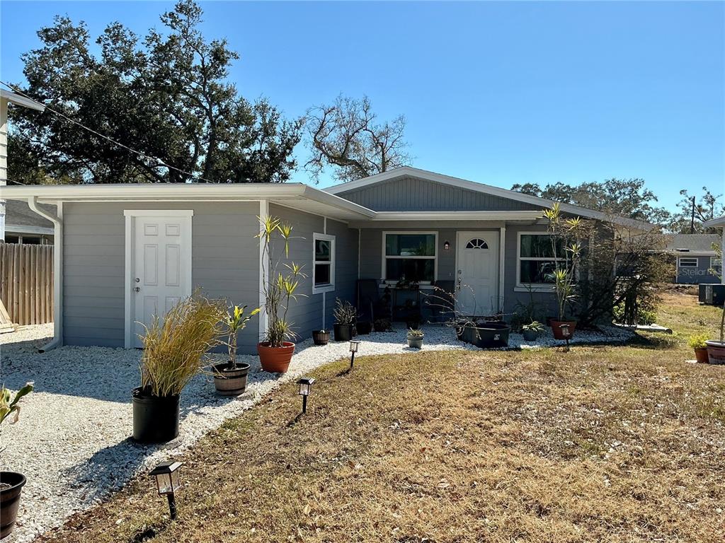 3020 Hawthorne Street Sarasota, FL 34239 - Photo 2 of 22 a view of a house with backyard sitting area and garden