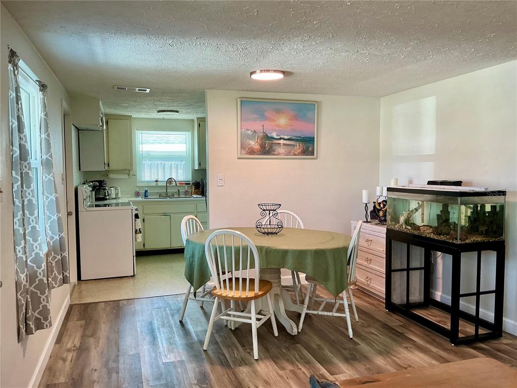 3020 Hawthorne Street Sarasota, FL 34239 - Photo 5 of 22 a view of a dining room with furniture and wooden floor