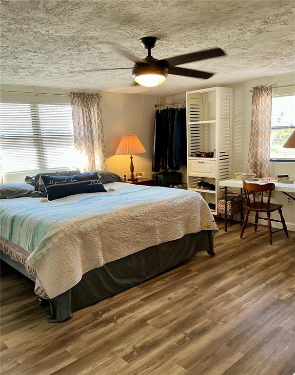 3020 Hawthorne Street Sarasota, FL 34239 - Photo 10 of 22 a bedroom with a bed and wooden floor