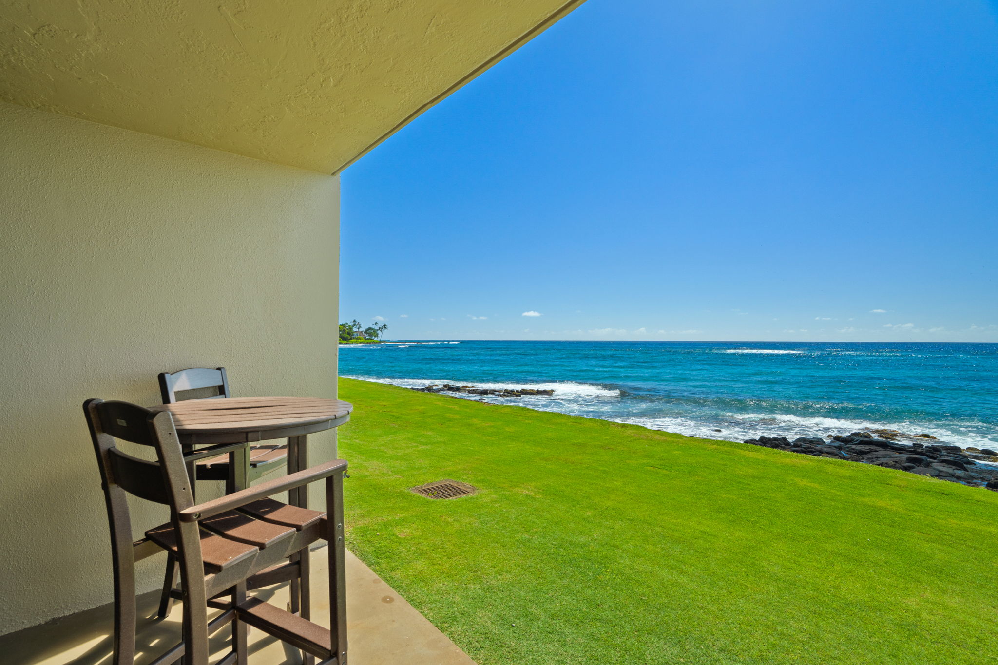 5050 Lawai Road, Unit 113 Koloa, HI 96756 - Photo 15 of 18 a view of a table and chairs in patio