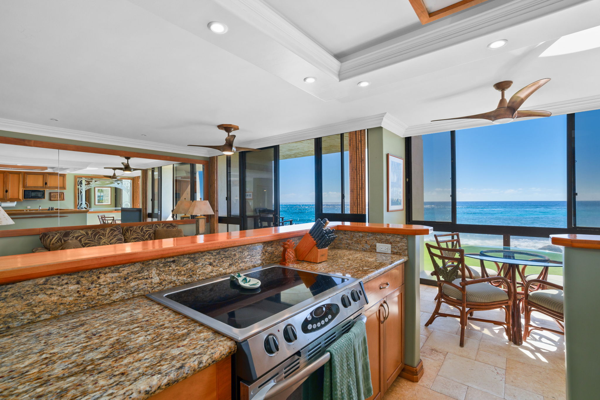 5050 Lawai Road, Unit 113 Koloa, HI 96756 - Photo 2 of 18 a kitchen with stainless steel appliances granite countertop a stove and a sink