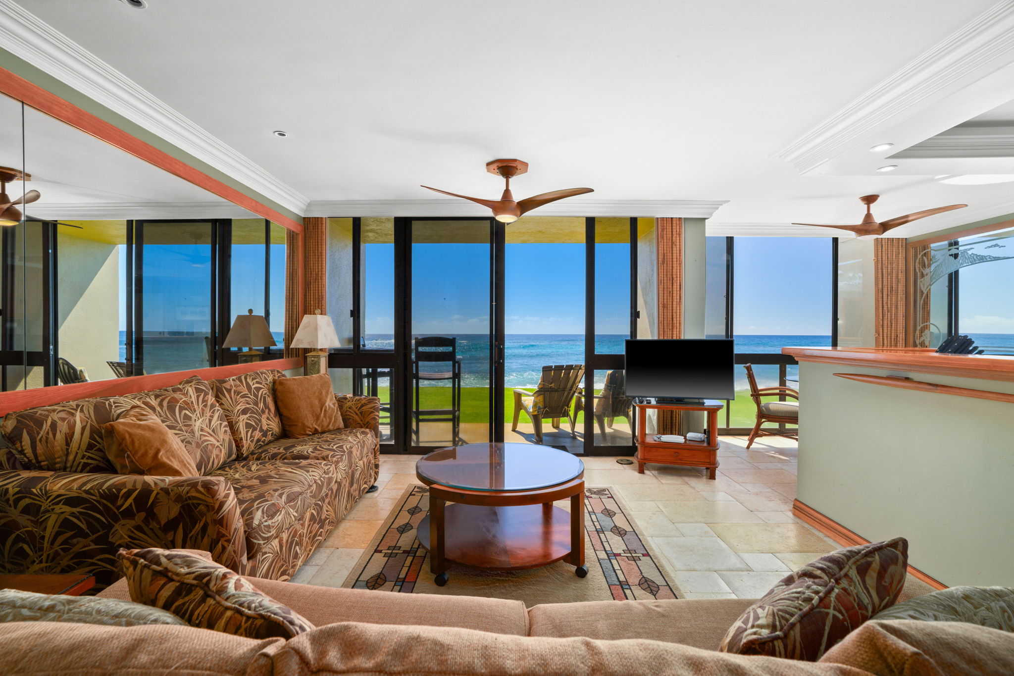 5050 Lawai Road, Unit 113 Koloa, HI 96756 - Photo 8 of 18 a living room with furniture and a large window
