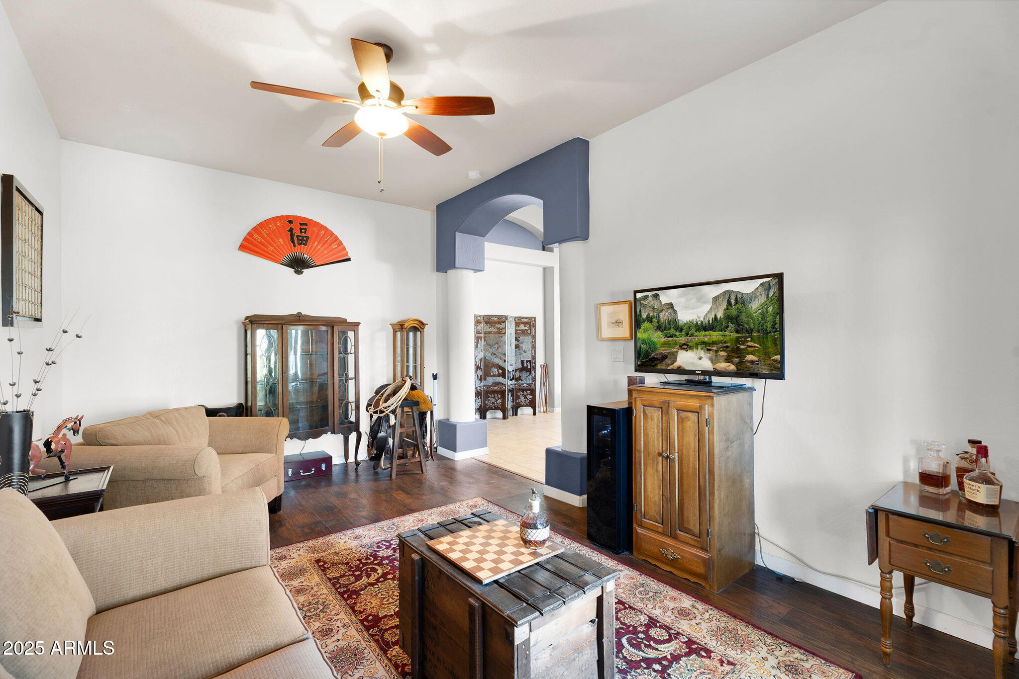 907 East Carlise Road Phoenix, AZ 85086 - Photo 10 of 70 a living room with furniture a flat screen tv and kitchen view