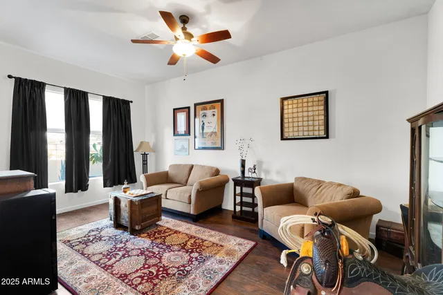 a kitchen with granite countertop a refrigerator and a stove top oven