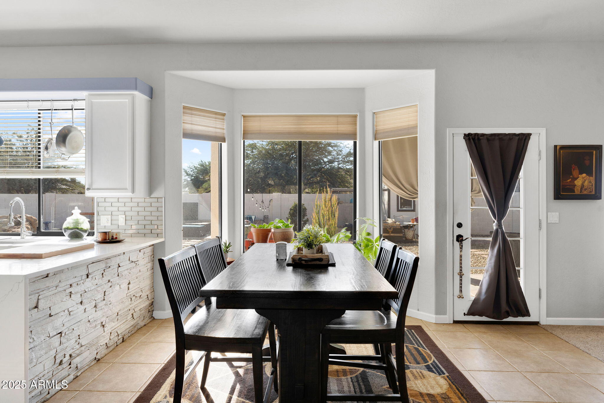 907 East Carlise Road Phoenix, AZ 85086 - Photo 17 of 70 a view of a dining room with furniture window and outside view