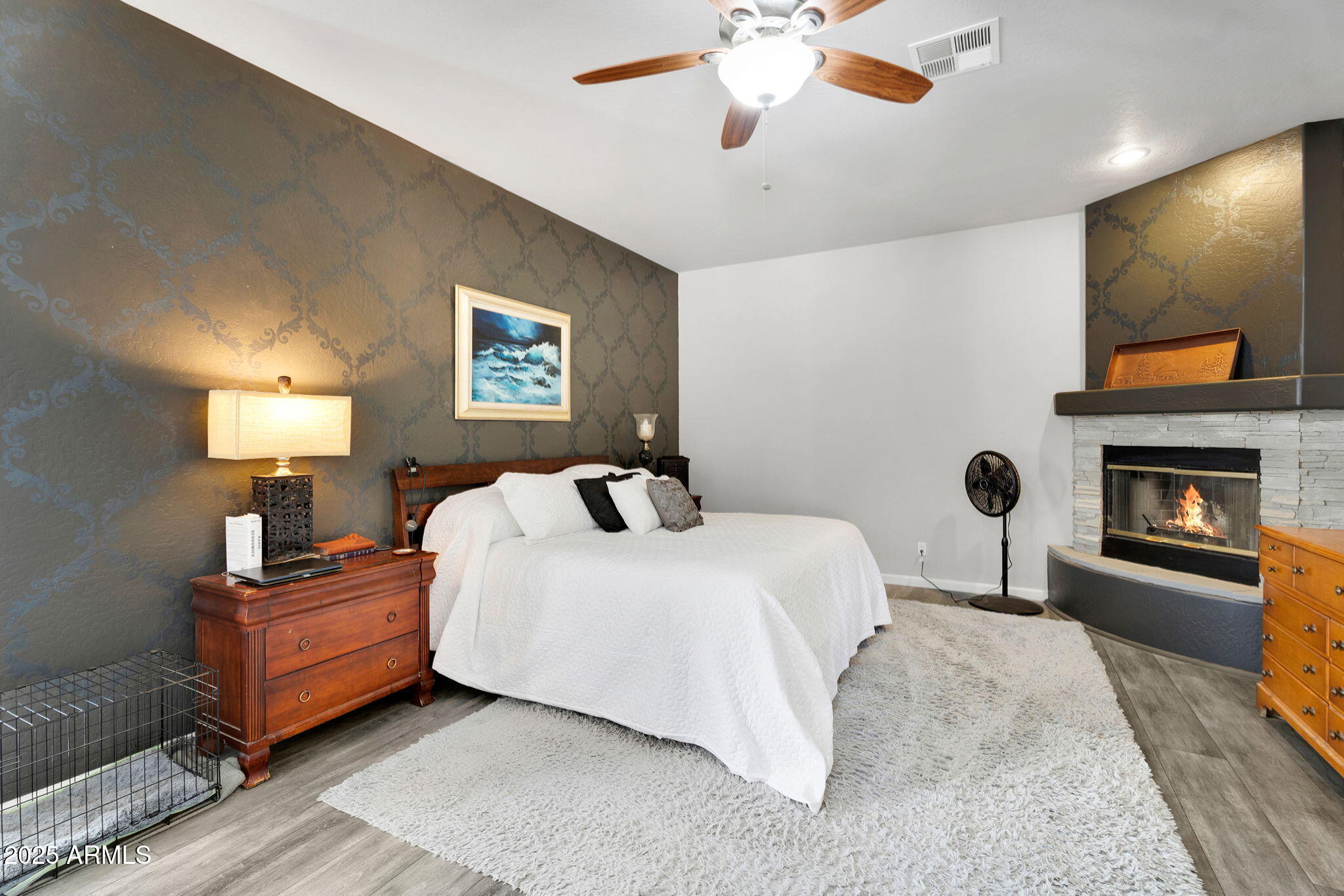 907 East Carlise Road Phoenix, AZ 85086 - Photo 19 of 70 a bedroom with a bed and a fireplace
