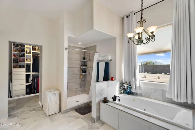 a view of a livingroom with workspace and a window