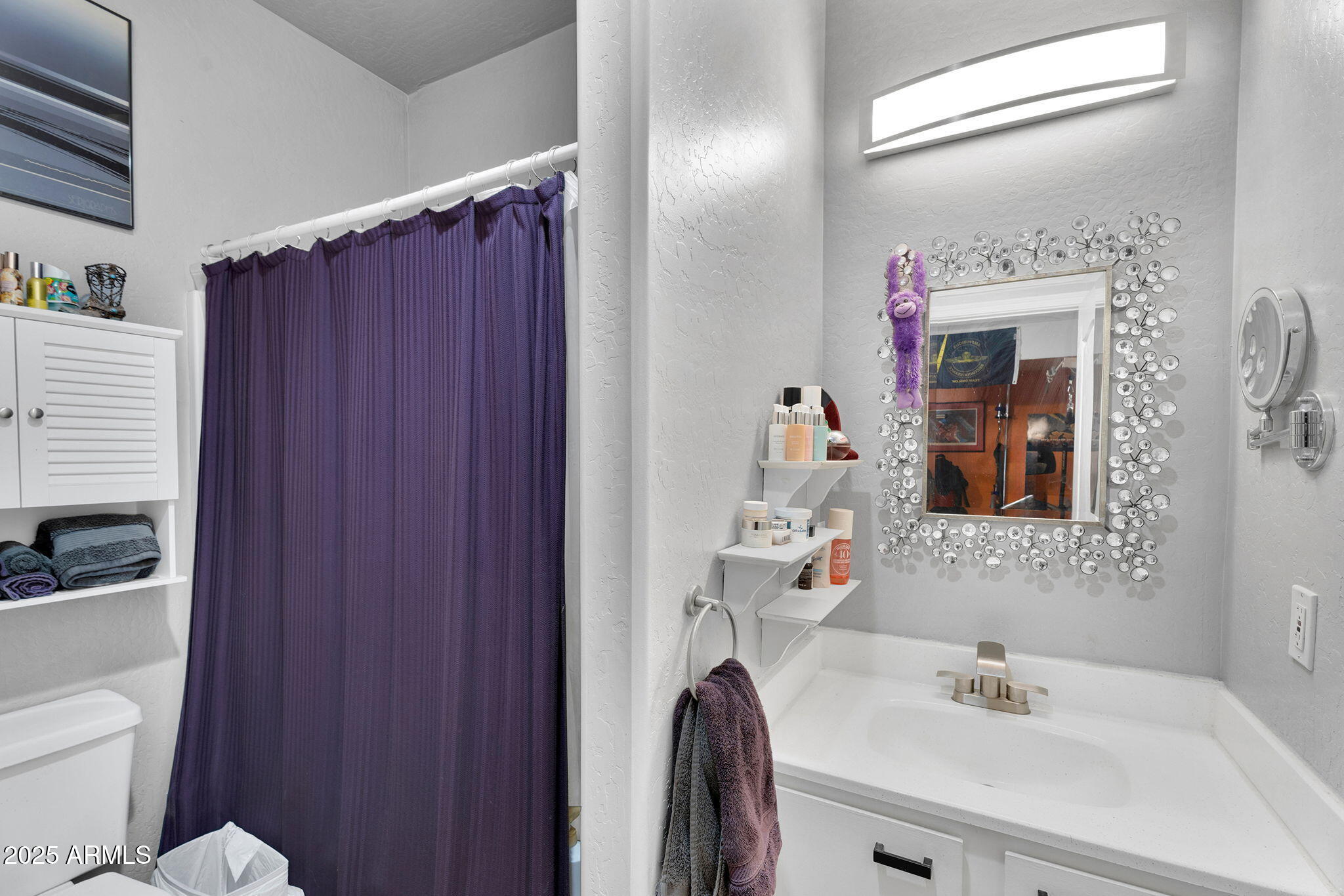 907 East Carlise Road Phoenix, AZ 85086 - Photo 34 of 70 a bathroom with a sink vanity mirror and toilet