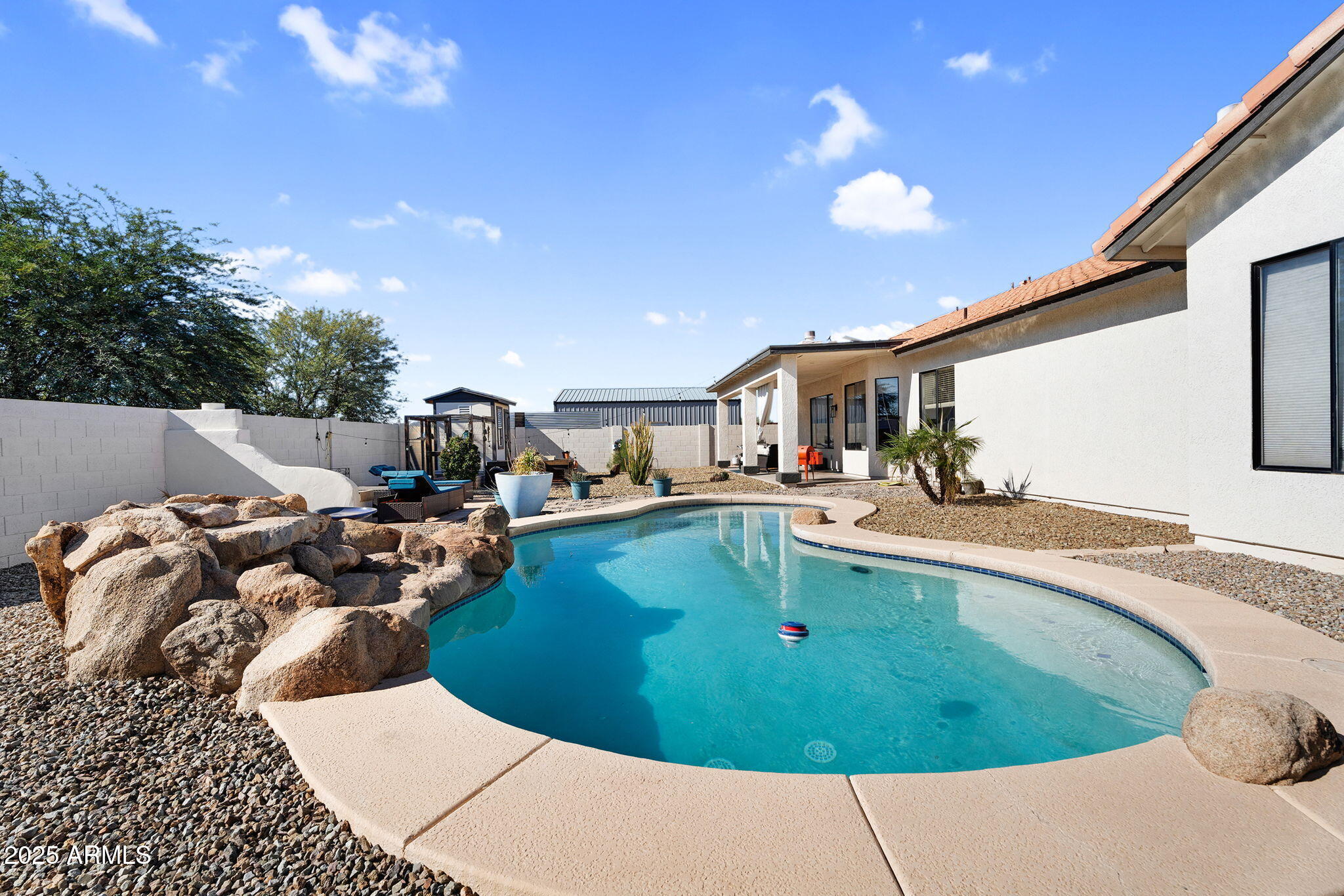 907 East Carlise Road Phoenix, AZ 85086 - Photo 37 of 70 a view of a swimming pool with outdoor seating