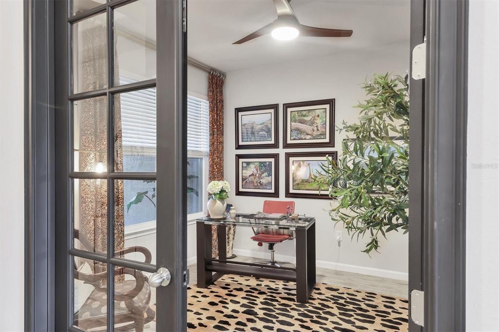 8733 Rain Song Road Sarasota, FL 34238 - Photo 18 of 39 a dining room with furniture and a window