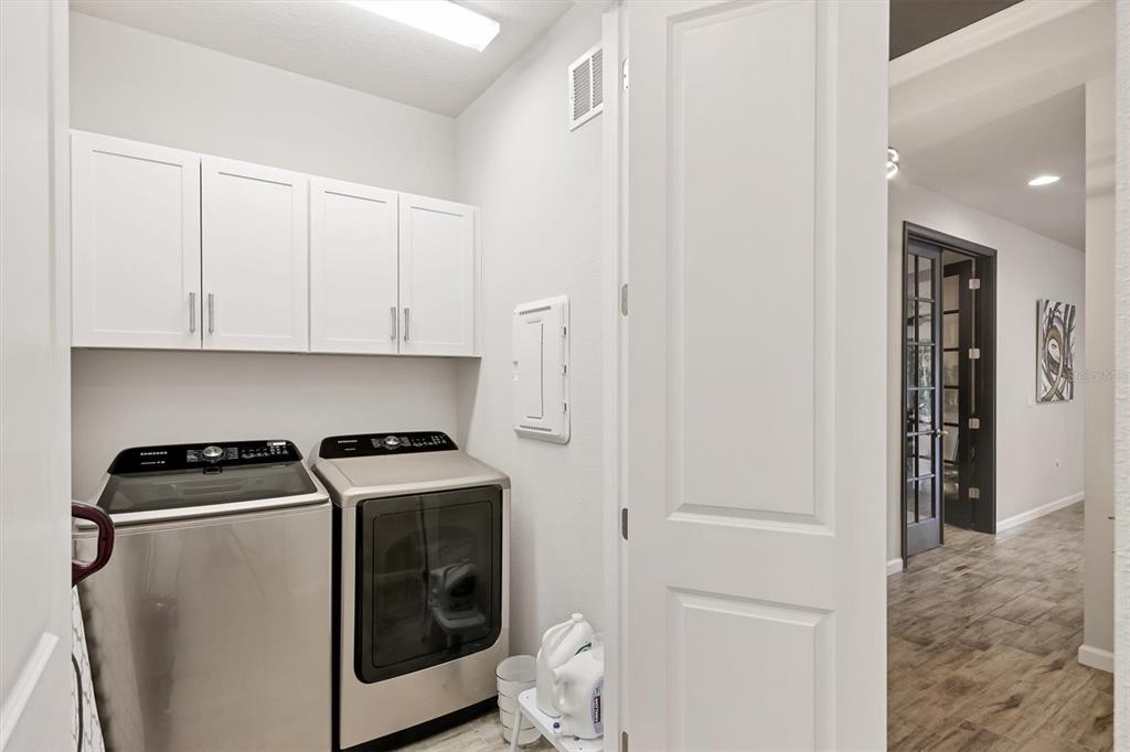 8733 Rain Song Road Sarasota, FL 34238 - Photo 20 of 39 a utility room with dryer and washer