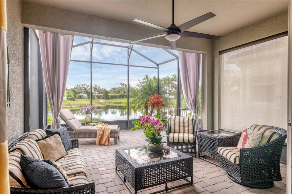 8733 Rain Song Road Sarasota, FL 34238 - Photo 21 of 39 a living room with furniture and a window