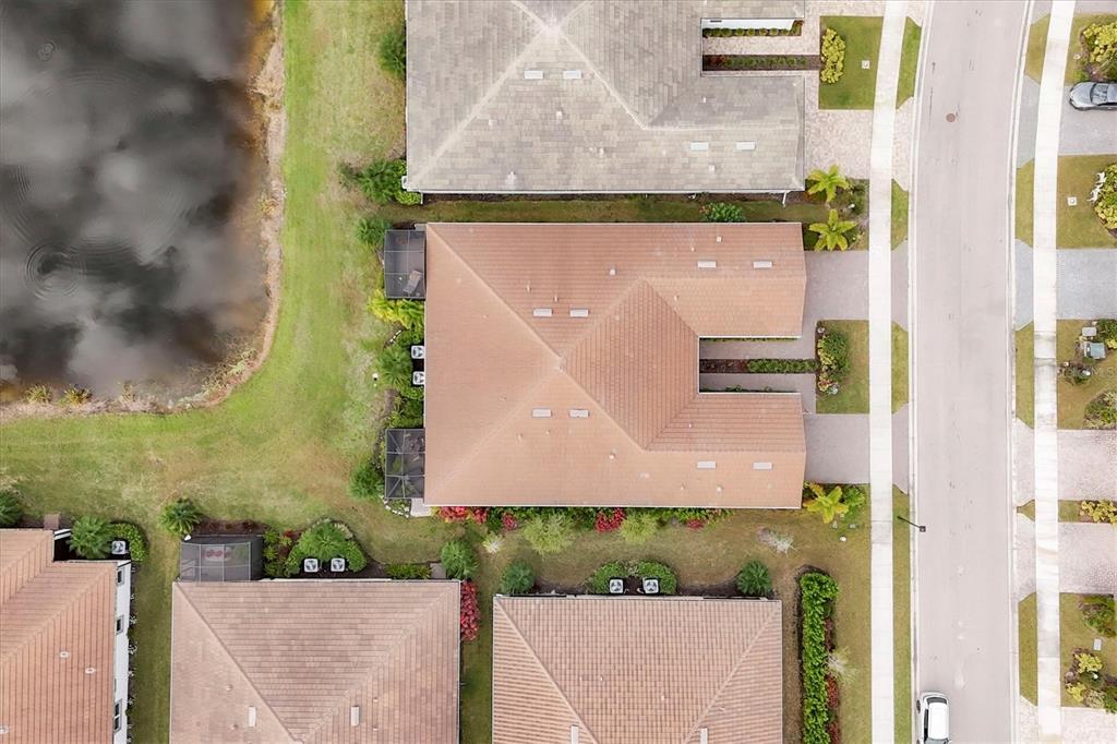 8733 Rain Song Road Sarasota, FL 34238 - Photo 28 of 39 an aerial view of a house with a yard