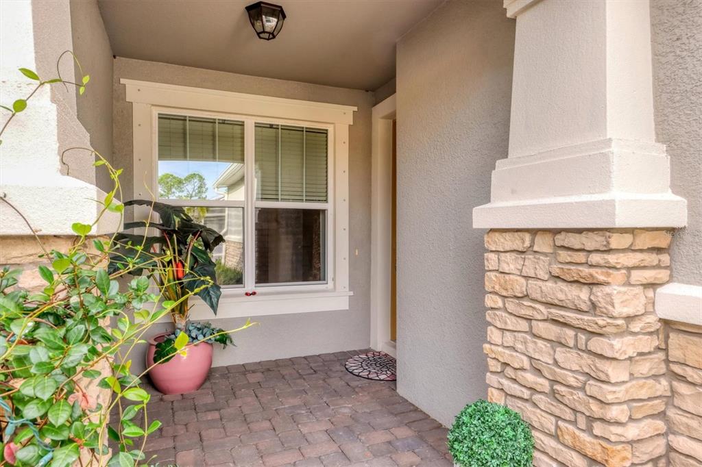 8733 Rain Song Road Sarasota, FL 34238 - Photo 3 of 39 a front view of a house with outdoor space
