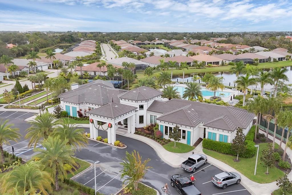 8733 Rain Song Road Sarasota, FL 34238 - Photo 32 of 39 an aerial view of residential houses with outdoor space and trees