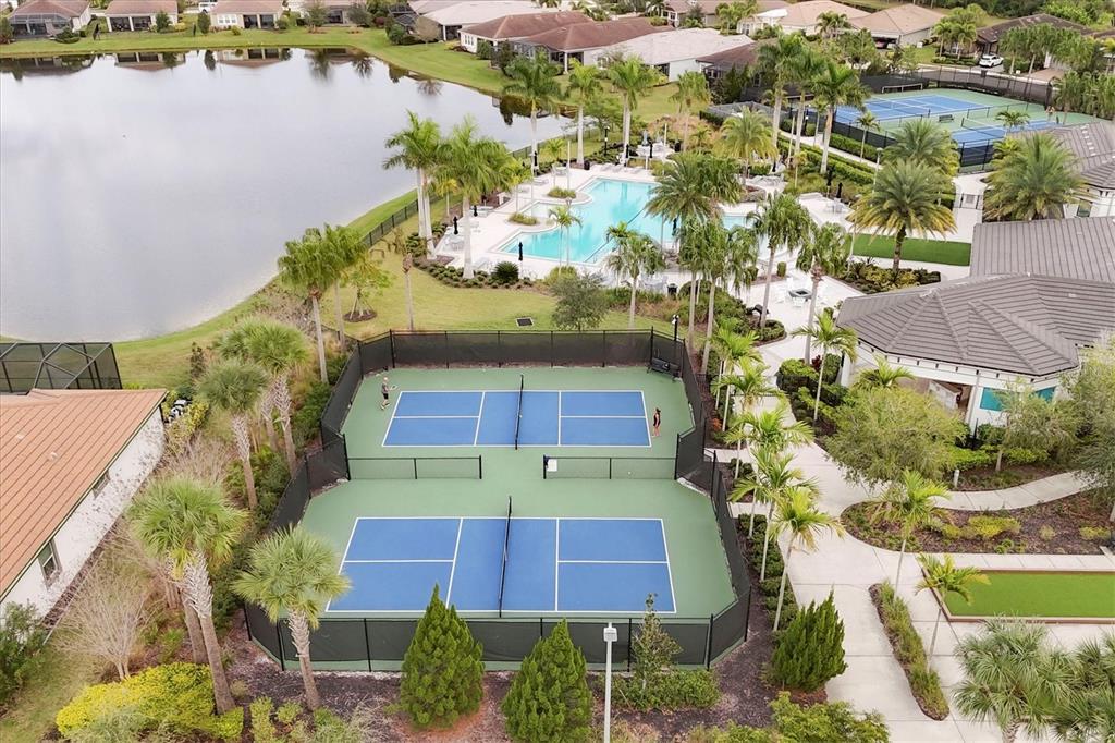 8733 Rain Song Road Sarasota, FL 34238 - Photo 35 of 39 an aerial view of residential houses with outdoor space and lake view