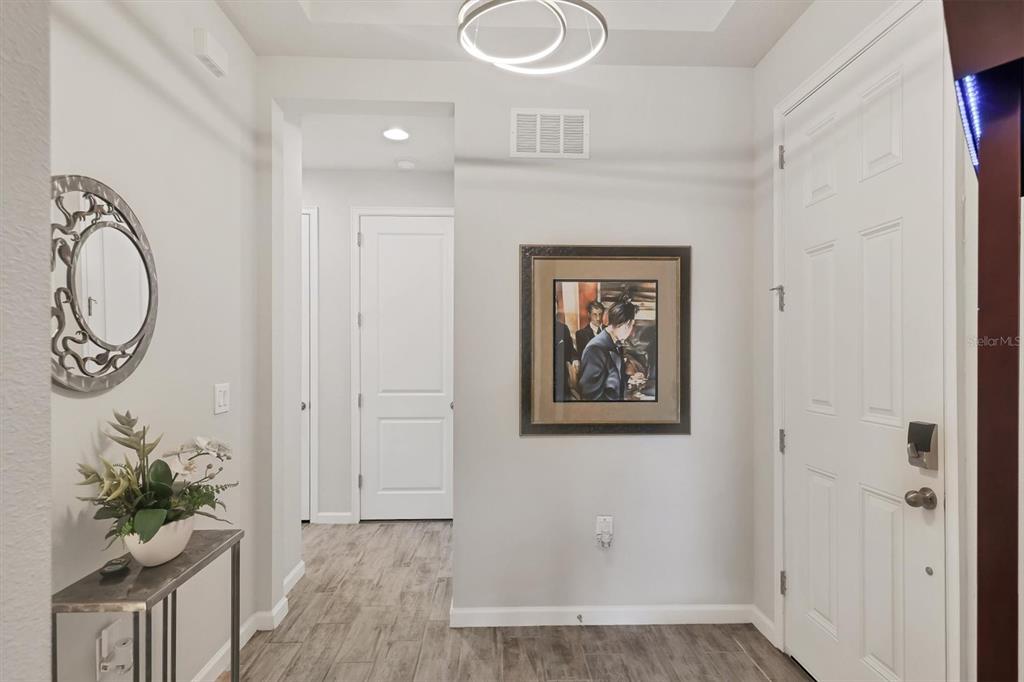 8733 Rain Song Road Sarasota, FL 34238 - Photo 4 of 39 a view of room with wooden floor and window