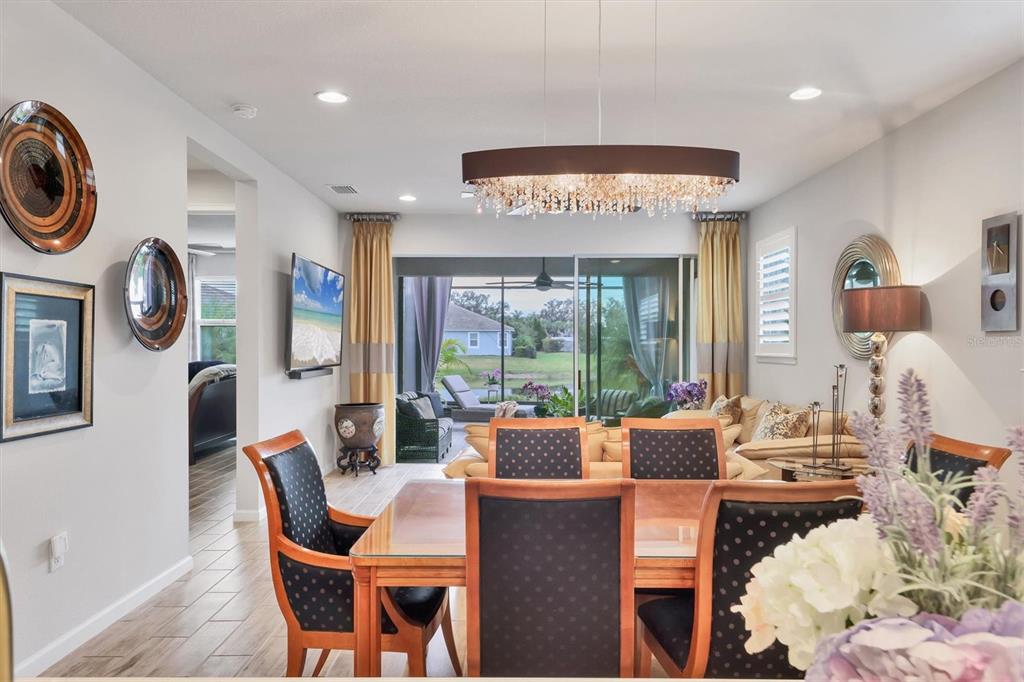 8733 Rain Song Road Sarasota, FL 34238 - Photo 9 of 39 a view of a dining room with furniture window and outside view