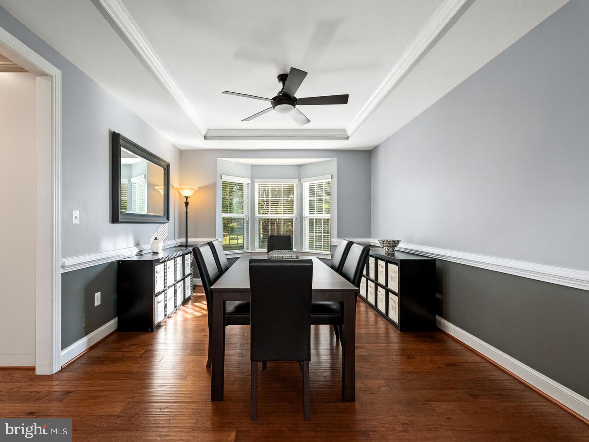 15511 Hillview Court Culpeper, VA 22701 - Photo 11 of 39 a view of a dining room with furniture window and wooden floor