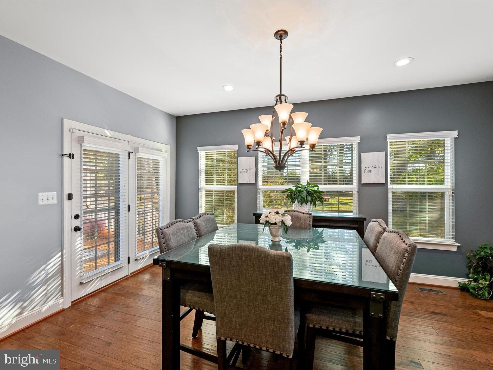 15511 Hillview Court Culpeper, VA 22701 - Photo 15 of 39 a view of a dining room with furniture a chandelier and wooden floor