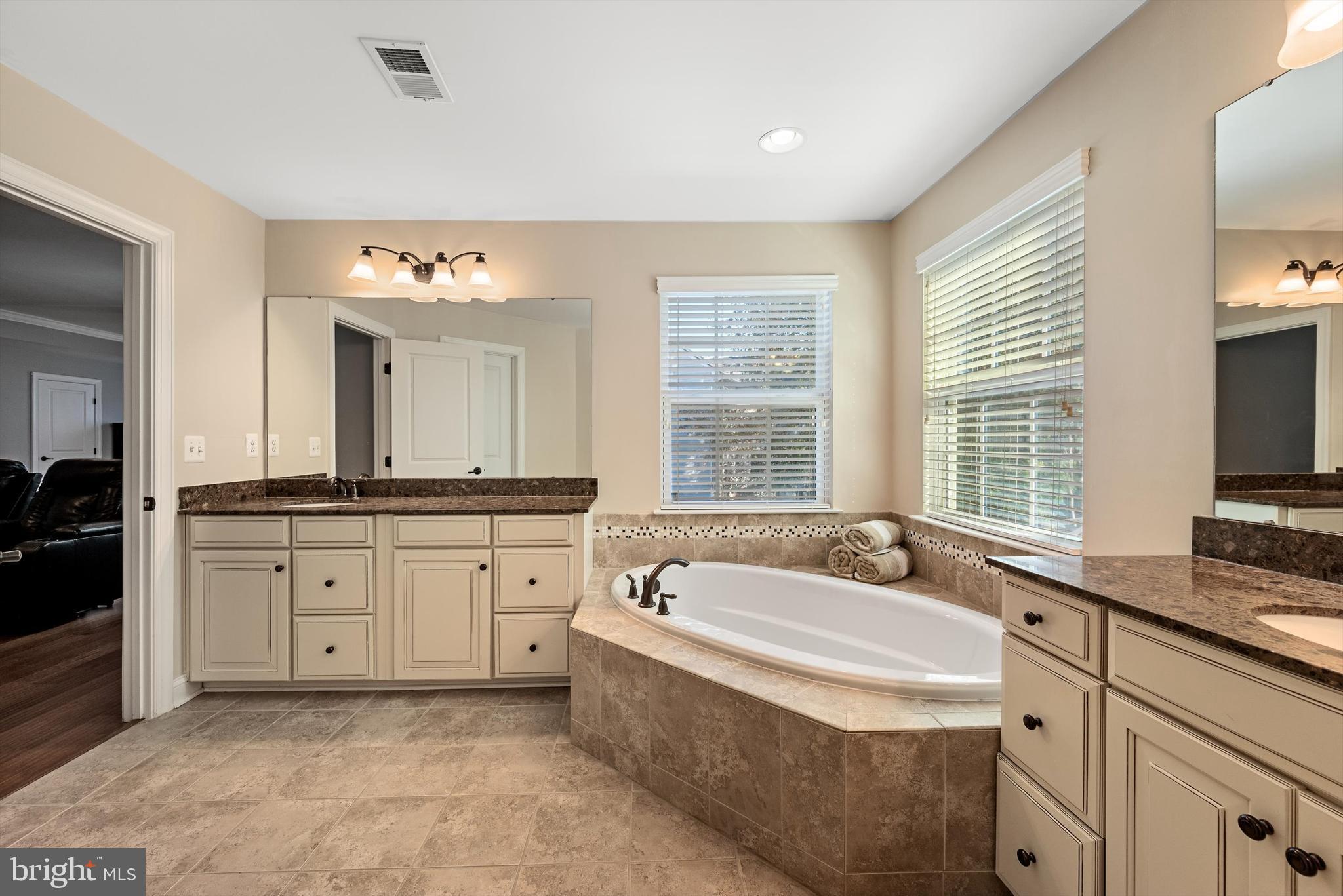 15511 Hillview Court Culpeper, VA 22701 - Photo 22 of 39 a spacious bathroom with a granite countertop tub sink and mirror