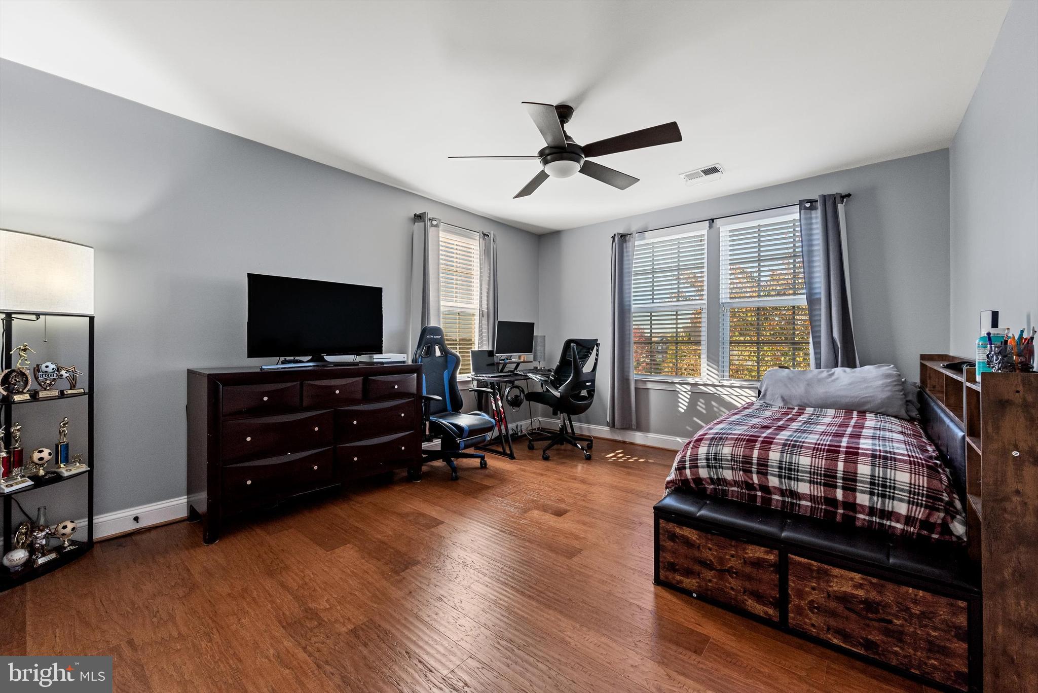 15511 Hillview Court Culpeper, VA 22701 - Photo 24 of 39 a bedroom with a bed and wooden floor