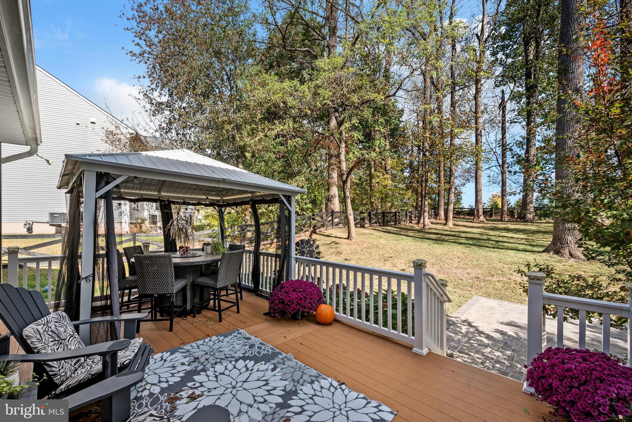 15511 Hillview Court Culpeper, VA 22701 - Photo 36 of 39 a view of a chair and tables under an umbrella