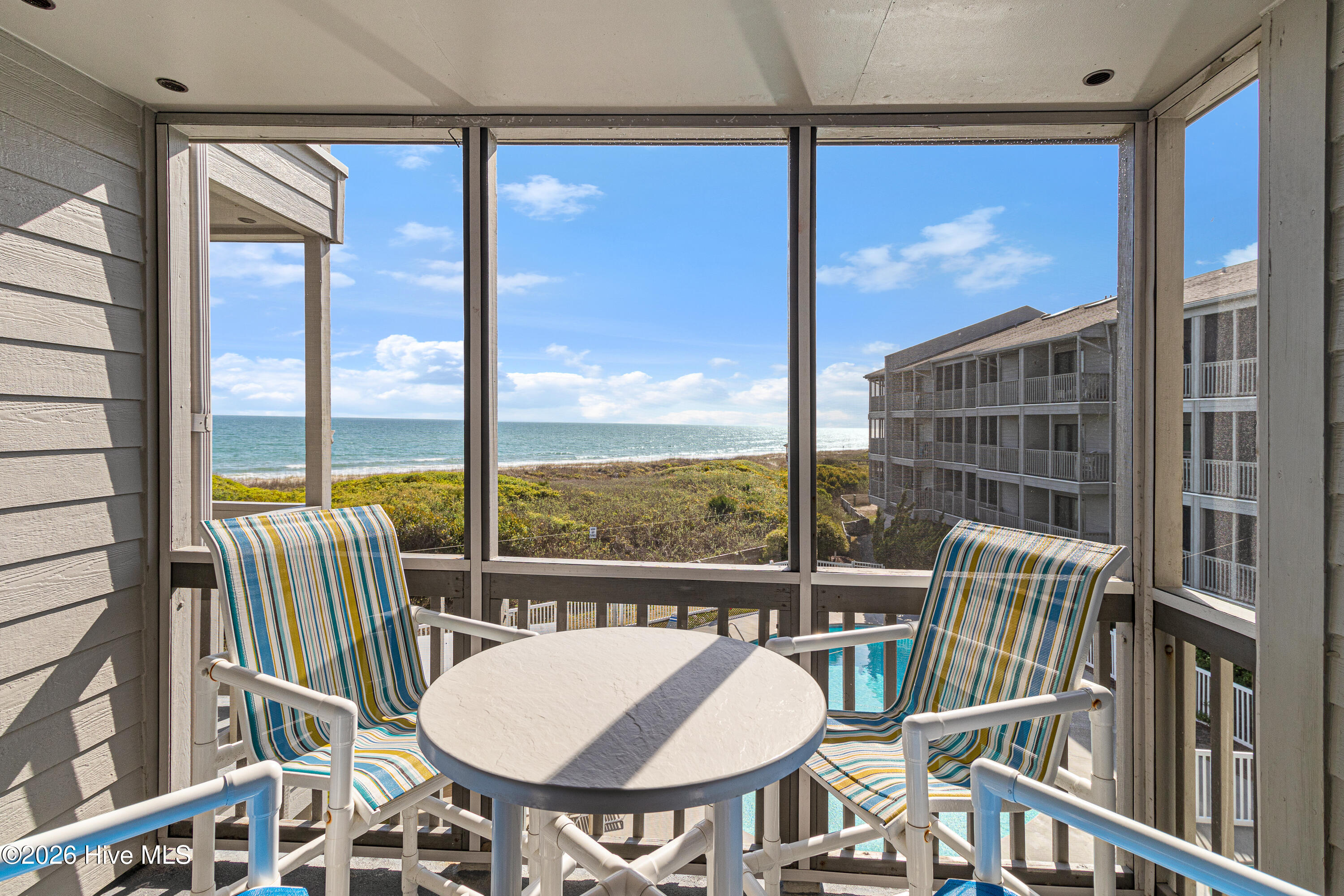 2111 West Fort Macon Road, Unit 248 DUNESCAPE Atlantic Beach, NC 28512 - Photo 17 of 45 Screened porch off of living room
