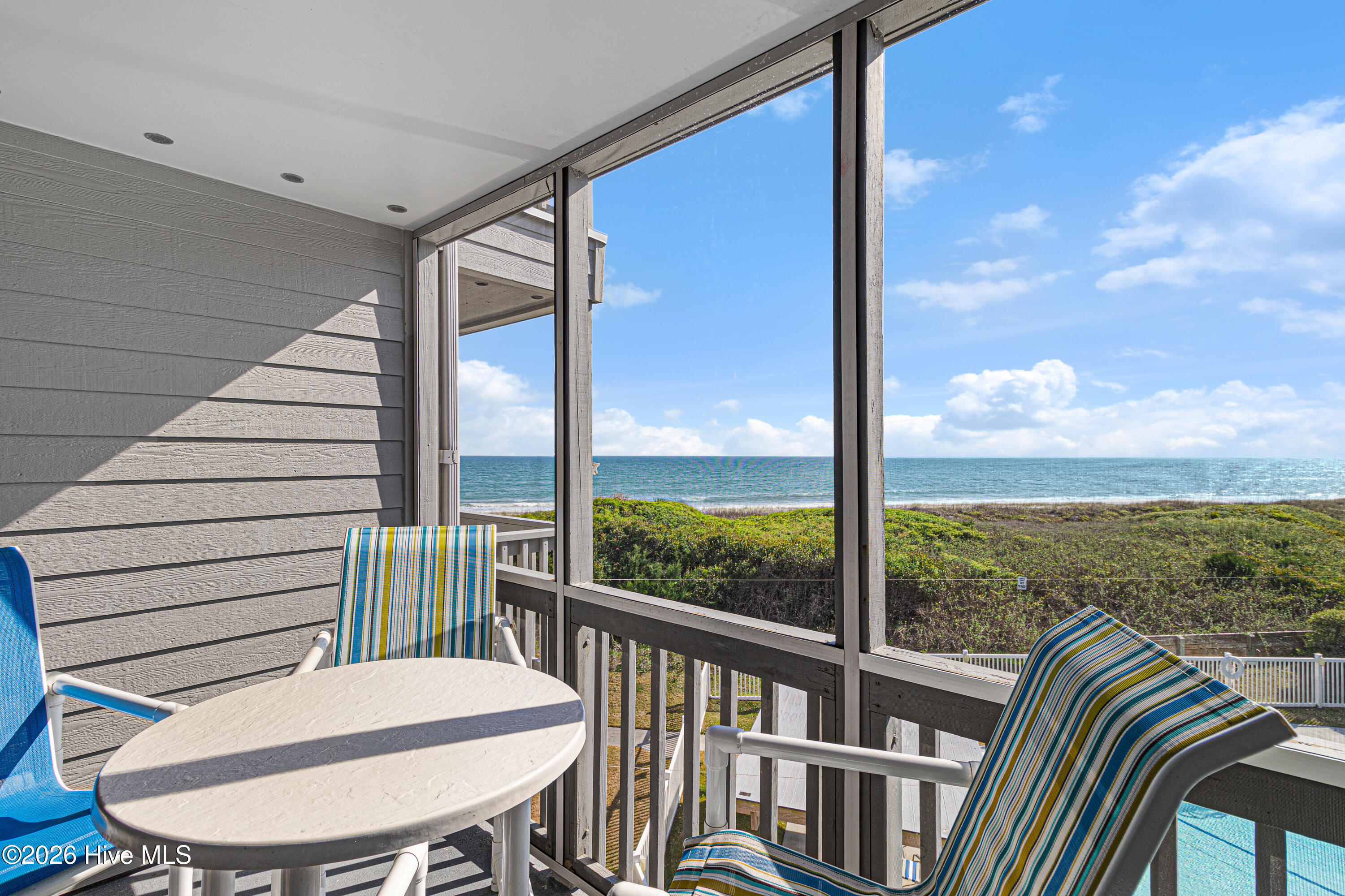 2111 West Fort Macon Road, Unit 248 DUNESCAPE Atlantic Beach, NC 28512 - Photo 5 of 45 Screened porch off of living room