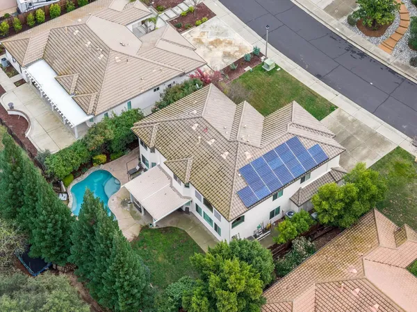 an aerial view of houses with outdoor space