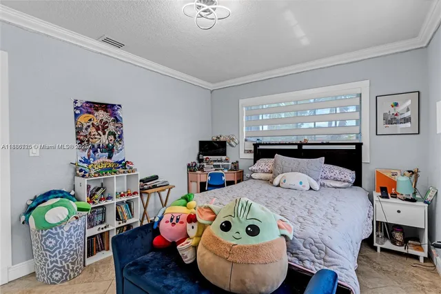 a bedroom with bed and a window