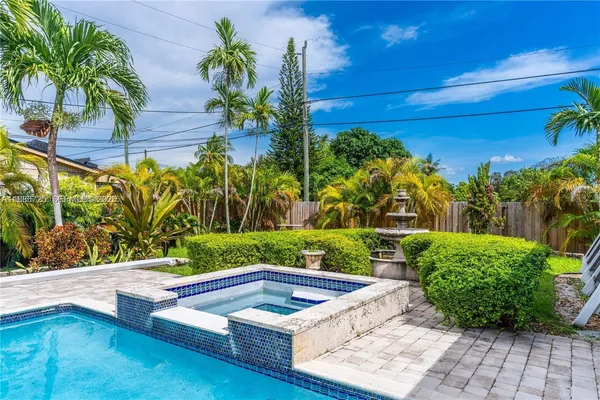 a view of swimming pool with a yard