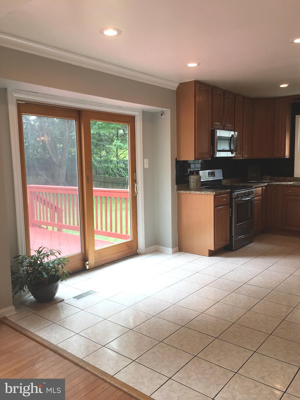 4917 Ten Mills Road Columbia, MD 21044 - Photo 6 of 28 High quality glass slider out to deck