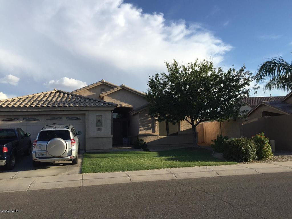 a view of a car park in front of house