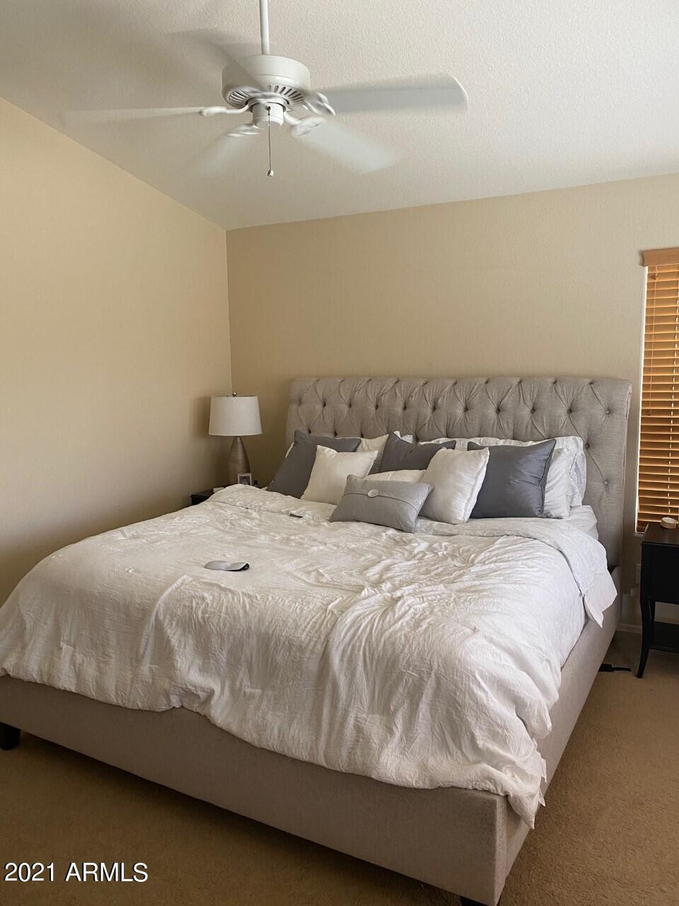321 West Cardinal Way Chandler, AZ 85286 - Photo 5 of 7 a large bed sitting in a bedroom next to a cabinet