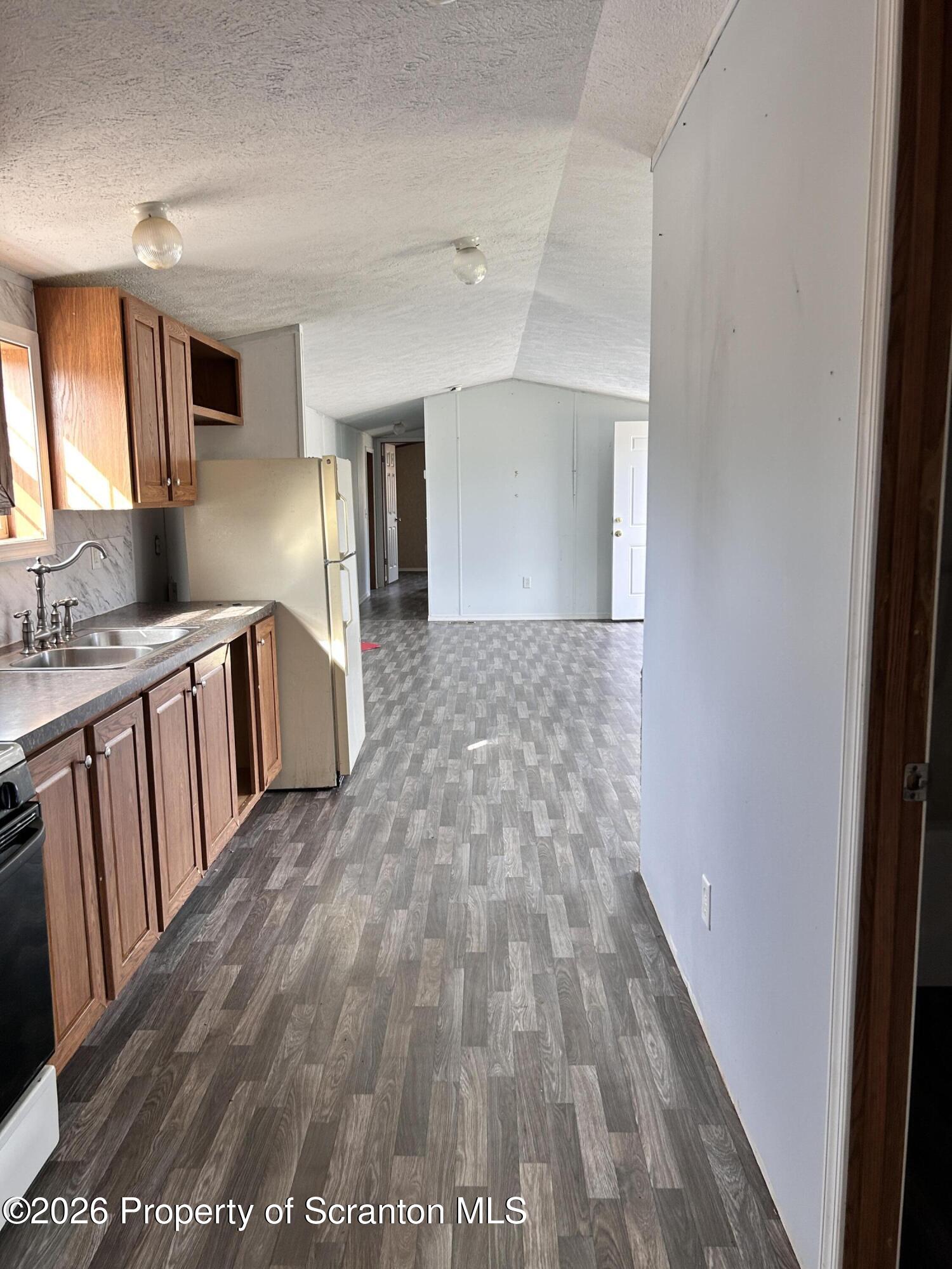 65 Ross Hill Road Thompson, PA 18465 - Photo 12 of 26 Kitchen to Living Room