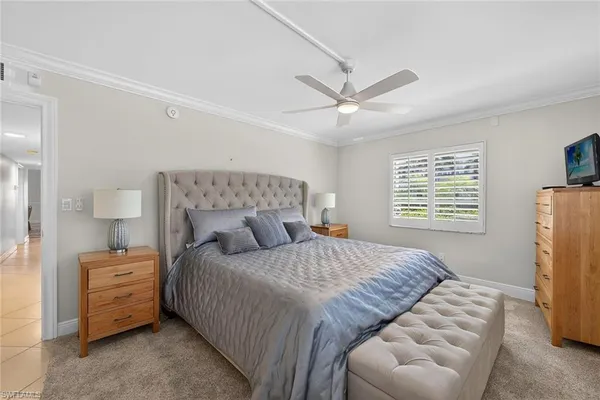 a bedroom with a bed and a couch