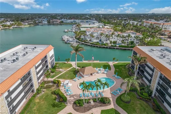 an aerial view of a house with a ocean view