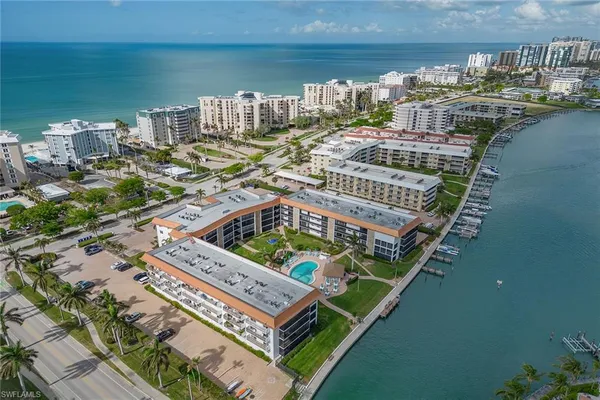 a view of a balcony with two chairs and a table