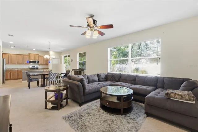 a kitchen with stainless steel appliances granite countertop a refrigerator a stove a sink and a refrigerator