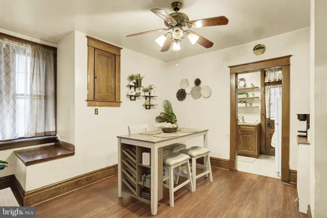 a kitchen with a refrigerator a stove and a window