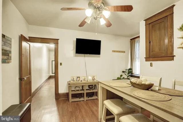 a bathroom with a window and a chair