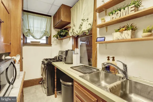 a view of a closet with storage and utility room