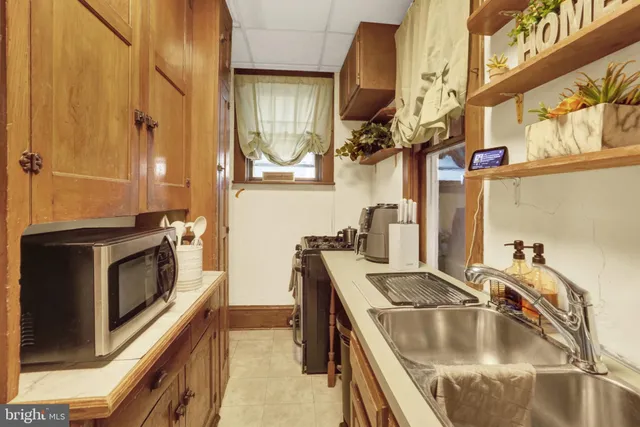 a very nice looking room with a large window and furniture