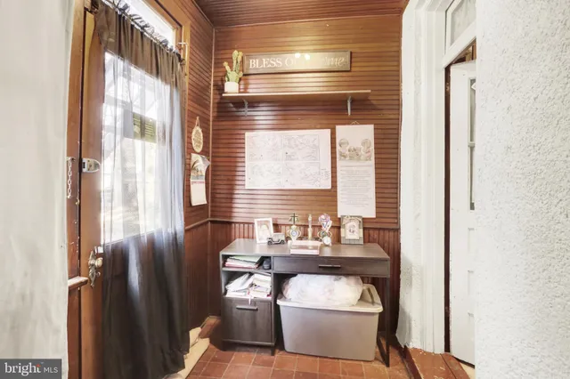 a room with furniture and air hockey table
